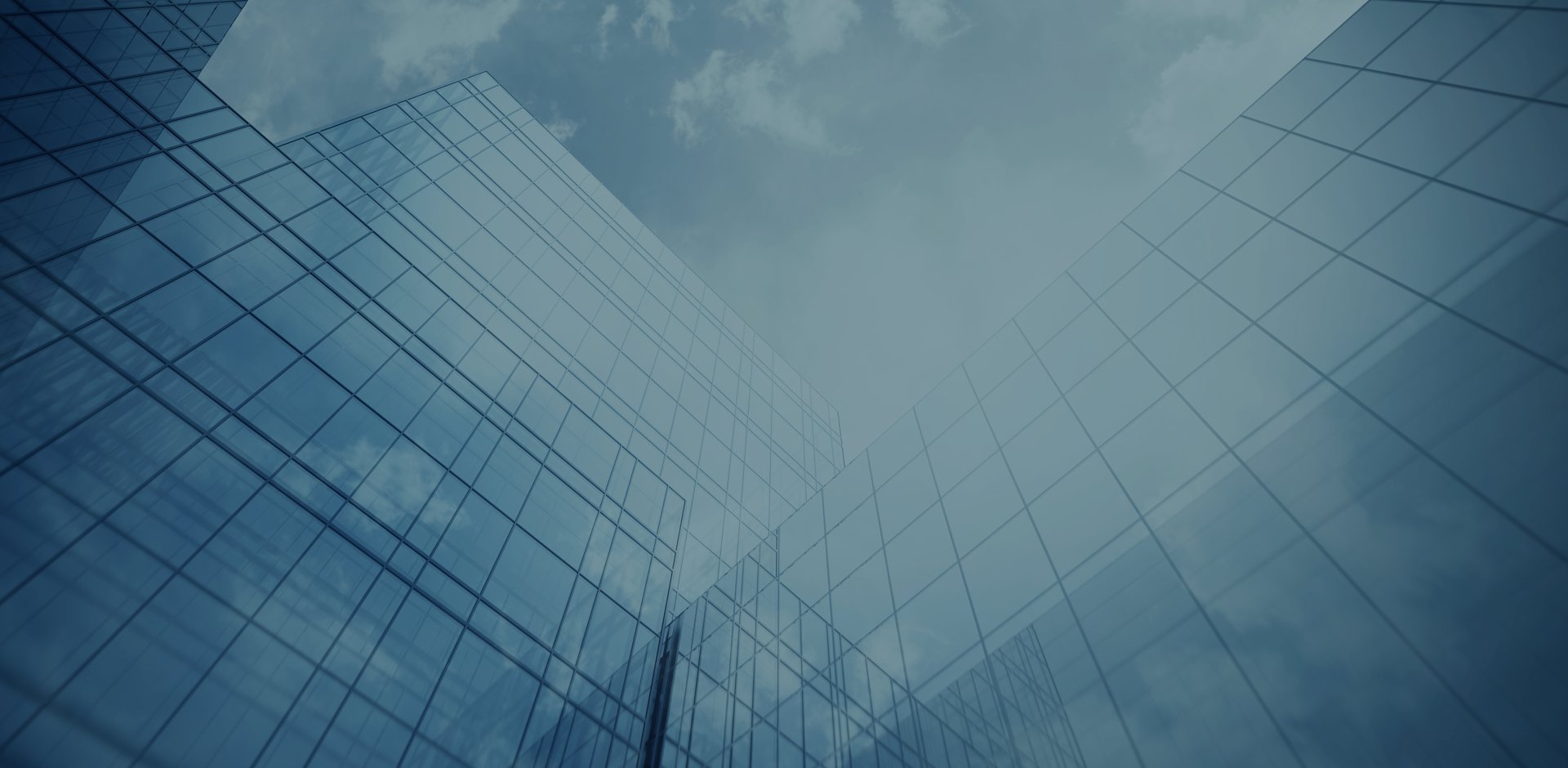 Tall Diatec Diagnostics building with windows and the sky with clouds